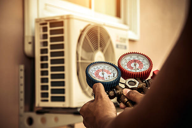 Professional Heat Pump Repair technician working in Gentry, AR